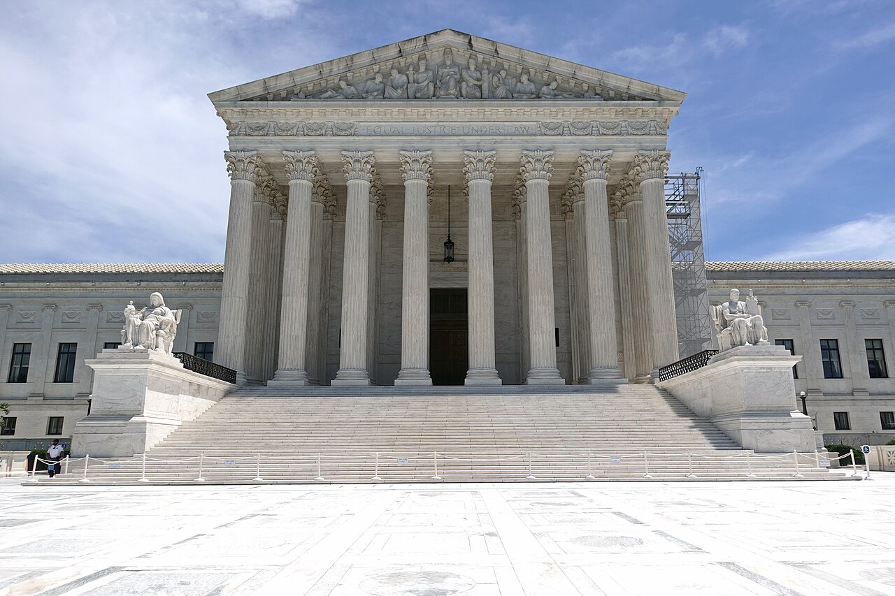 Marble columns, statues and broad steps at the front of the U.S. Supreme Court building.